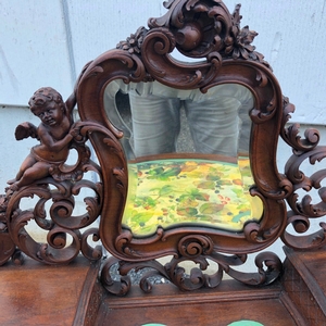 Louis XV style Fine carved french walnut vanity with putti