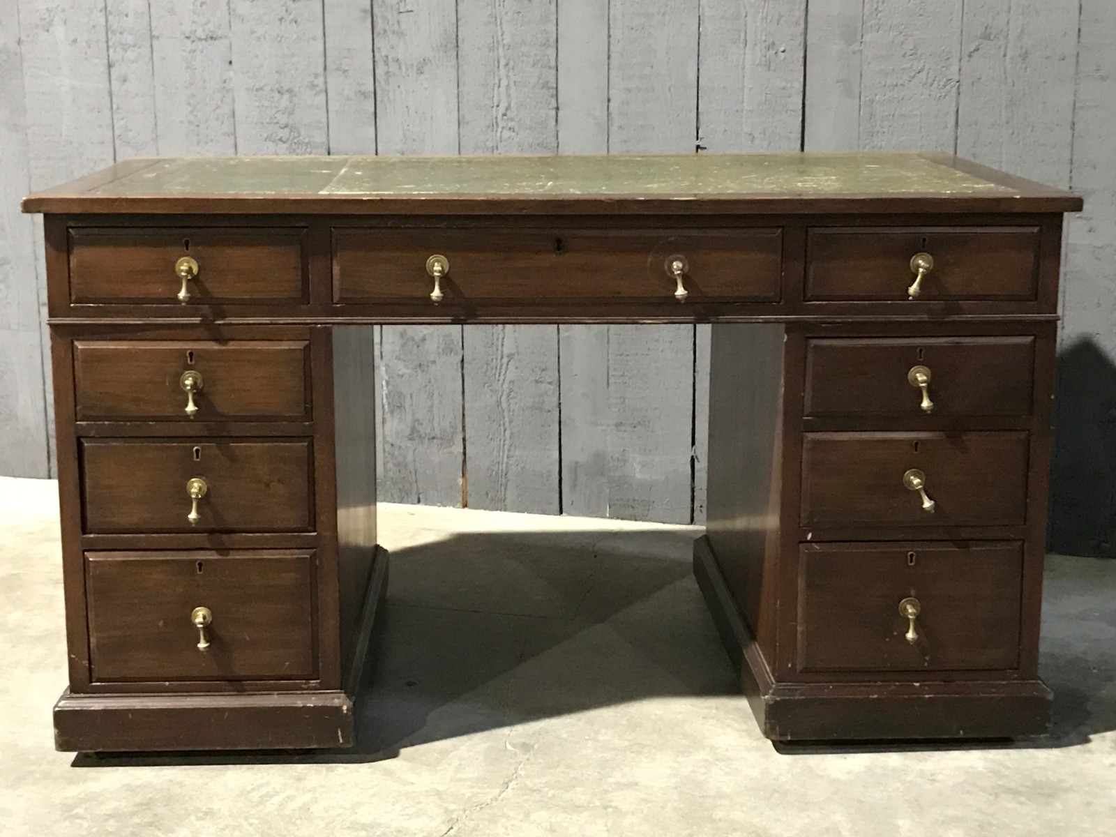 Mahogany english desk with drawers with green leather top 