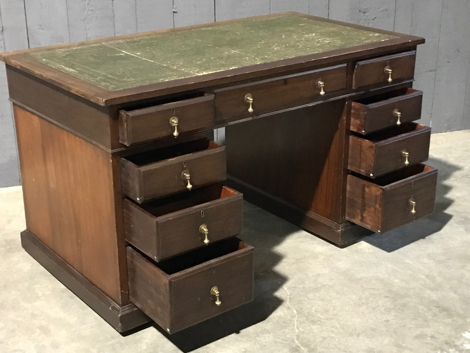 Mahogany english desk with drawers with green leather top 