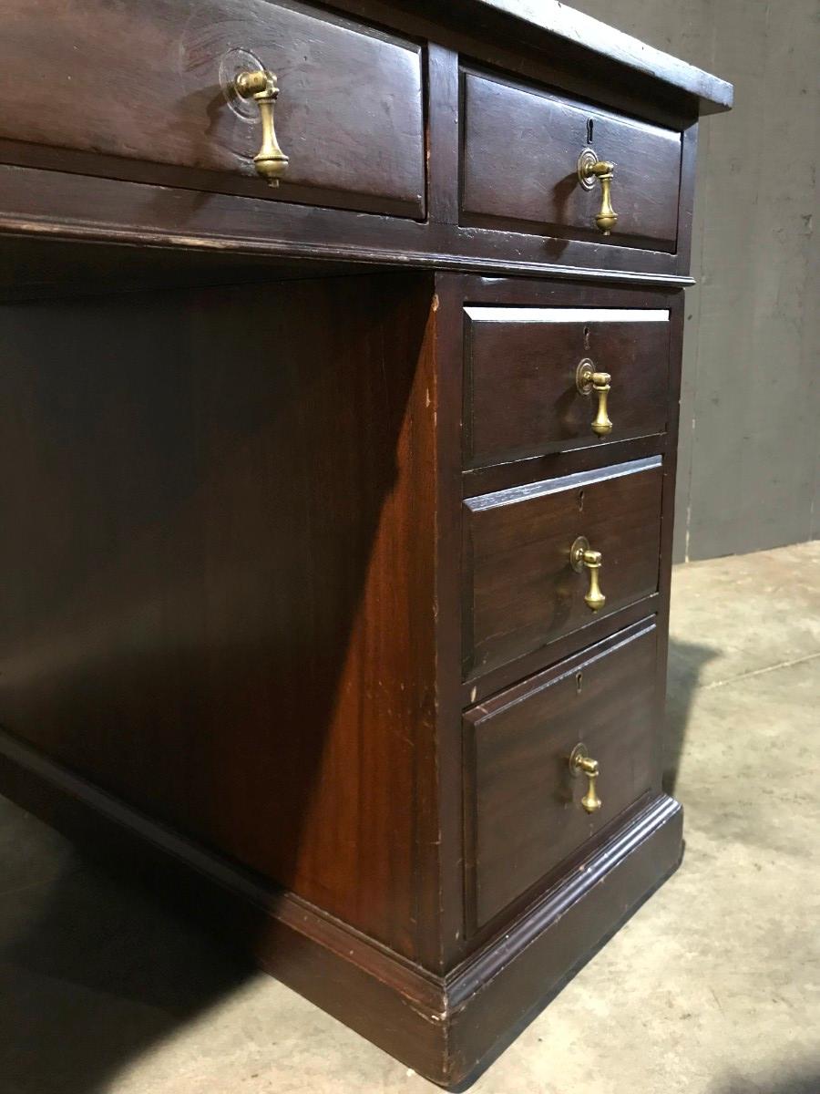 Mahogany english desk with drawers with green leather top 